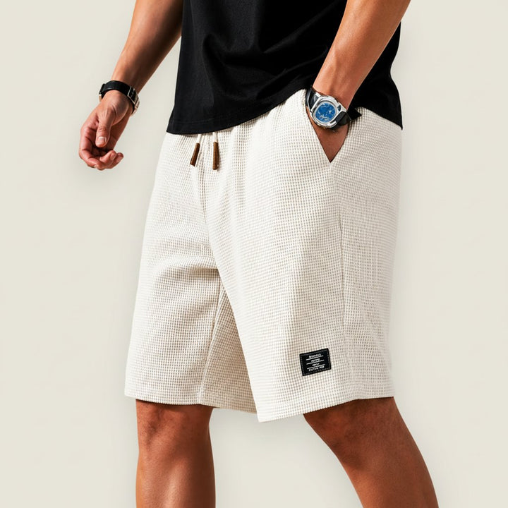 Casual men's summer shorts with elastic waist & drawstring, offering a comfortable, relaxed fit.