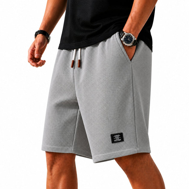 Soft, lightweight men's summer shorts with drawstring, great for casual wear & ultimate comfort.