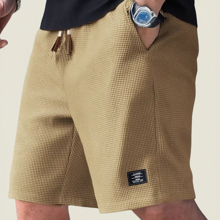 Relaxed fit men's summer shorts with elastic waist, designed for ultimate comfort in warm weather.
