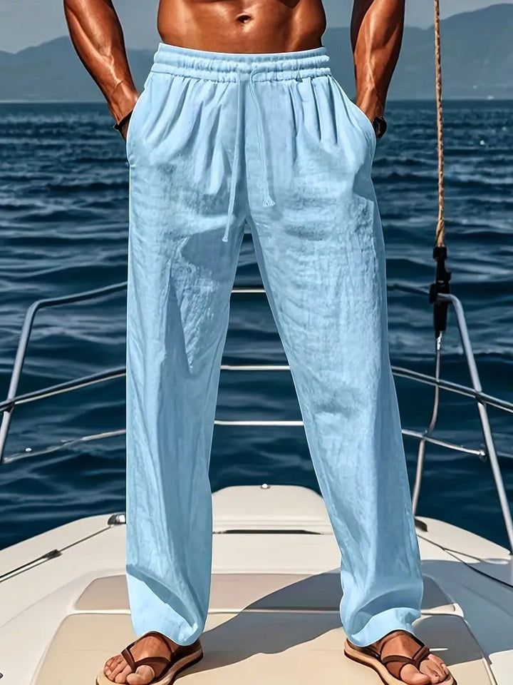 Relaxed fit men's trousers, drawstring chino style for casual wear and everyday comfort. Straight leg design.