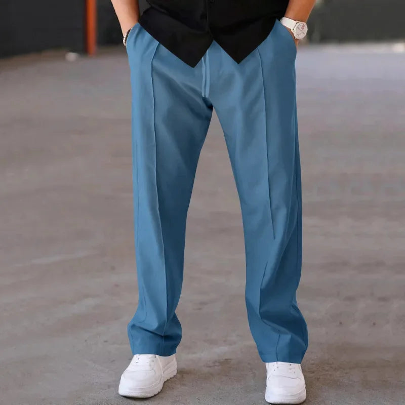 Men's loose-fit formal trousers on a hanger, showcasing the full length and design.