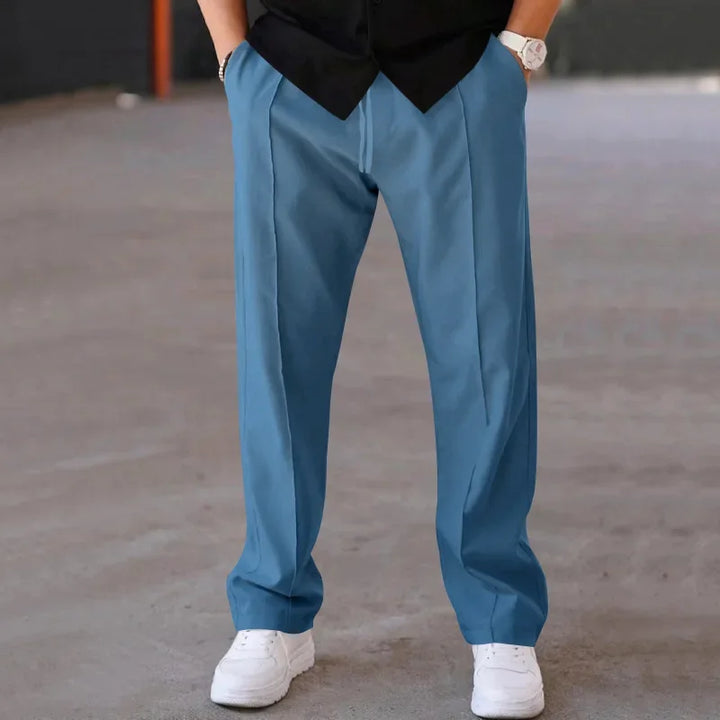 Men's loose-fit formal trousers on a hanger, showcasing the full length and design.