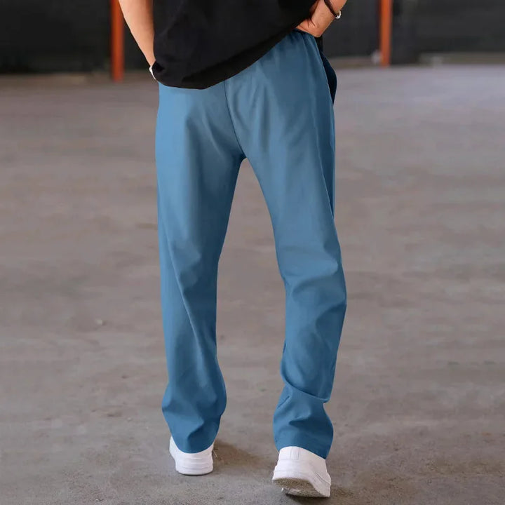 Men's loose-fit formal trousers in a subtle pinstripe pattern, enhancing business attire.