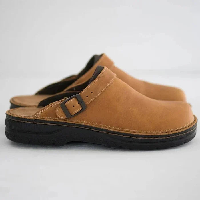 Men's luxury black leather slip-on clogs, elegant casual footwear for comfort.