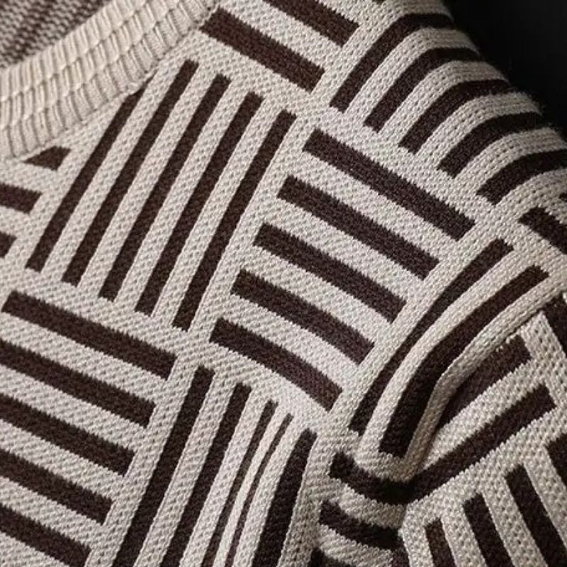 Elevated men's knit top with soft fabric, geometric design, and ribbed trim for versatile fashion.