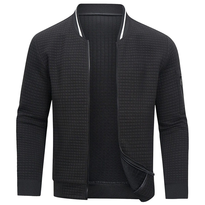 Detailed shot of men's Mitchell full-zip cardigan showing the textured grid knit & durable zipper closure.