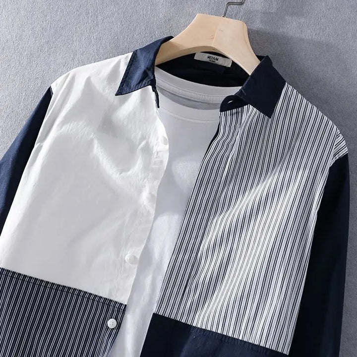 Close-up of a men's cotton blend short sleeve shirt featuring a contemporary contrast stripe design