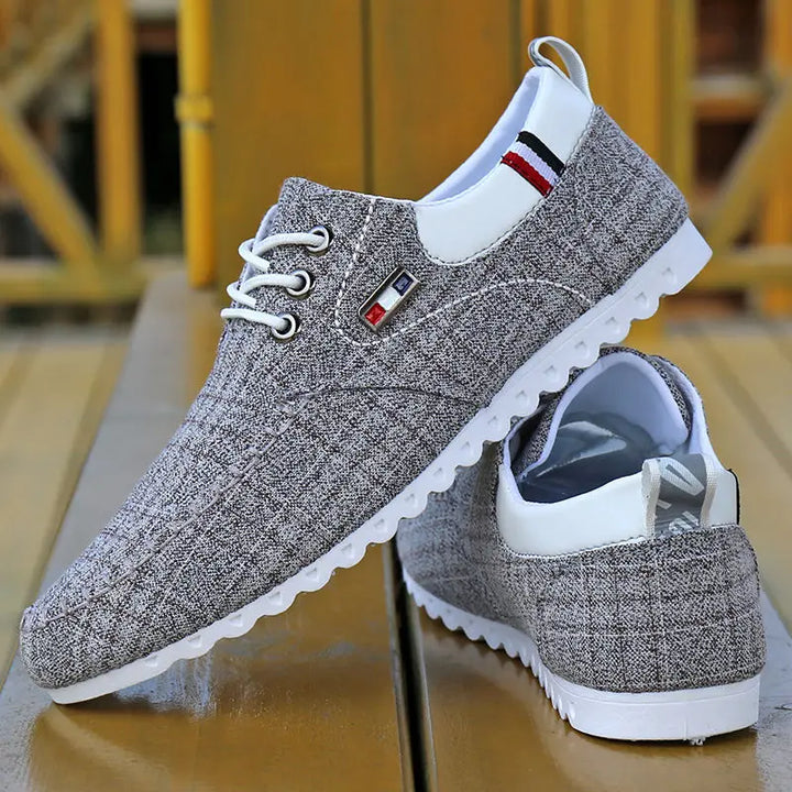 Top-down view of Men's Knit Comfort Sneakers, dark color, perfect for casual footwear and all-day comfort.