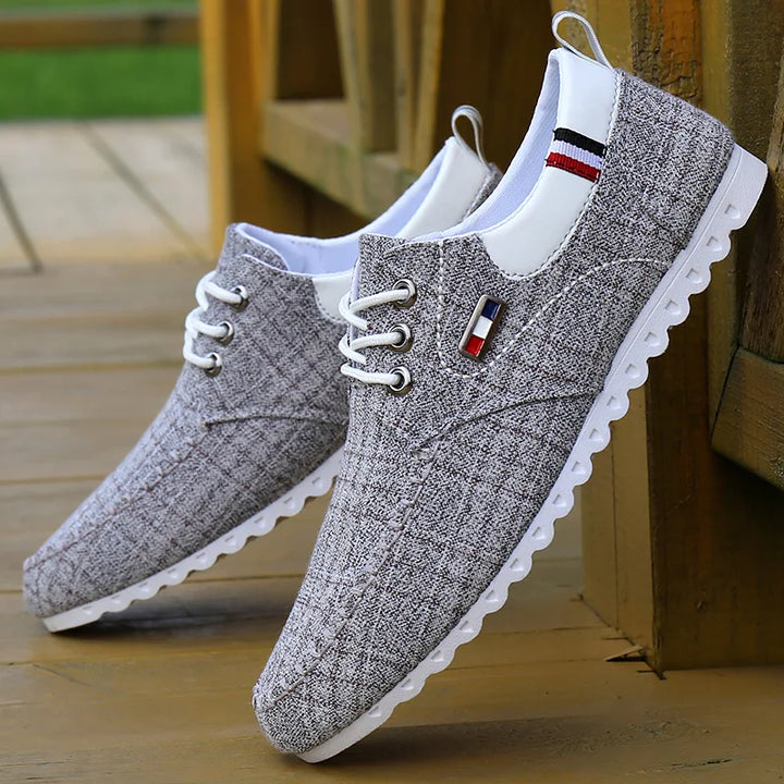 Pair of Men's Modern Knit Comfort Sneakers, new in box, ready for their next adventure as breathable shoes.