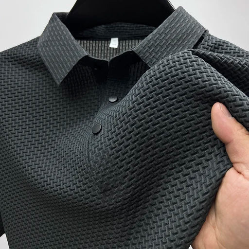Close-up of men's textured basketweave polo fabric, showcasing the unique pattern & quality for summer style.
