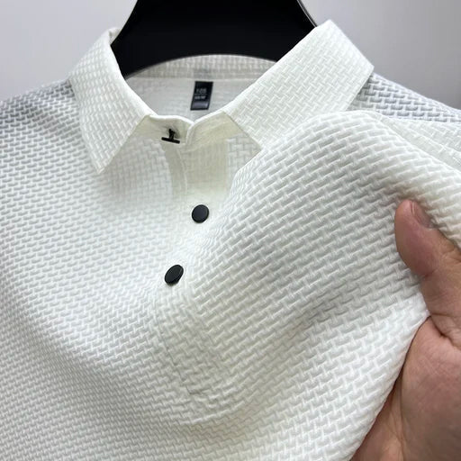 Man wearing a modern basketweave polo shirt, ideal for stylish summer outfits and smart casual occasions.