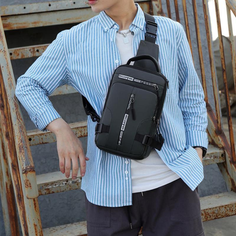 Close-up of waterproof fabric on men's sling bag, highlighting USB charging port and zipper details