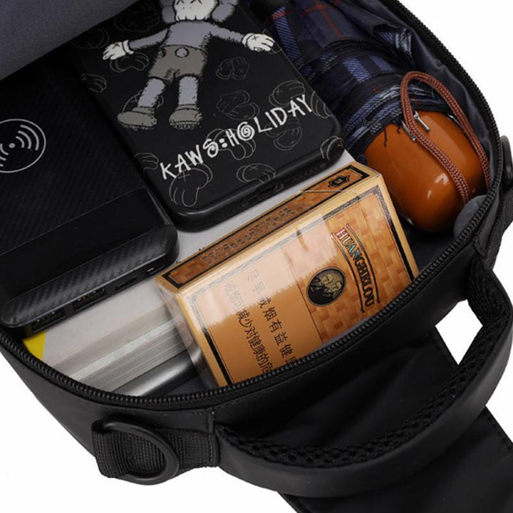 Detailed image of the USB charging port on the men's sling bag, ready for on-the-go power