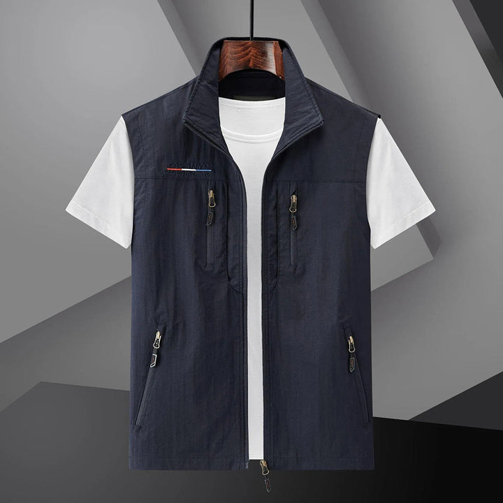 Men's multi-pocket outdoor utility vest. Ideal for travel, fishing, hiking. Breathable summer sleeveless jacket.