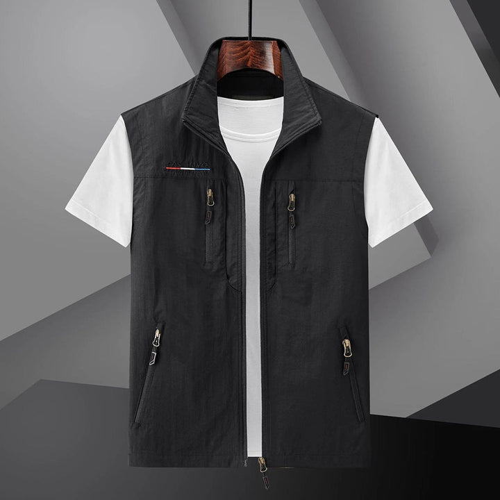 Men's summer travel vest with multiple pockets for essentials. Safari style sleeveless jacket, breathable for adventures.