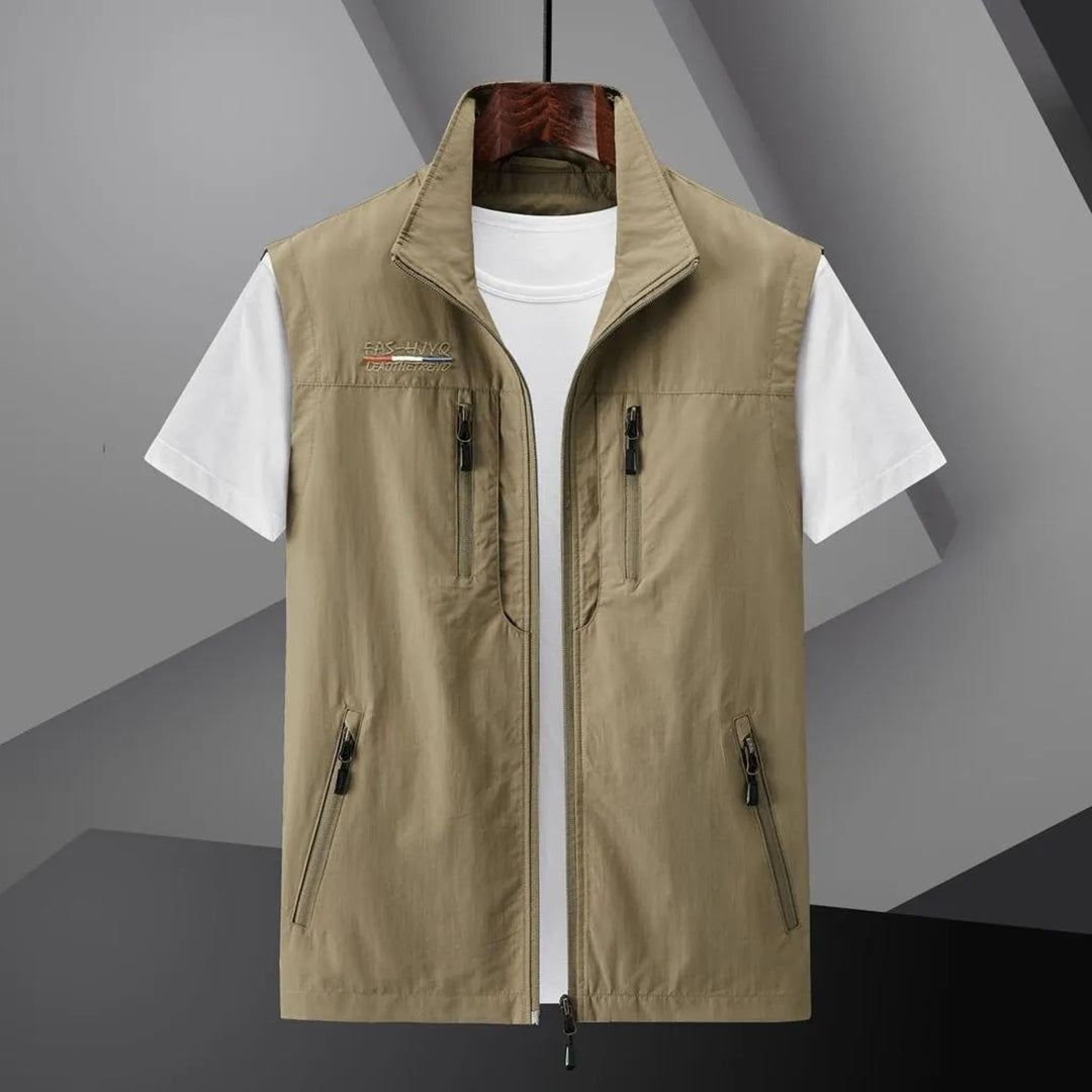 Safari-style men's multi-pocket outdoor vest. Breathable sleeveless jacket for summer travel and adventures.