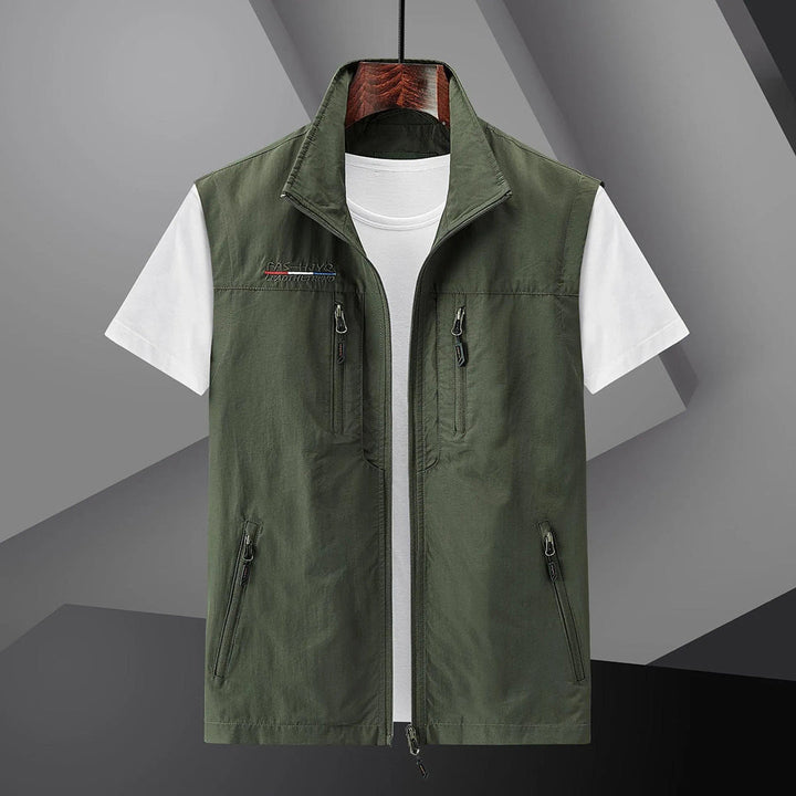 Lightweight men's outdoor utility vest. Multi-pocket design perfect for summer travel, fishing, hiking. Breathable fabric.