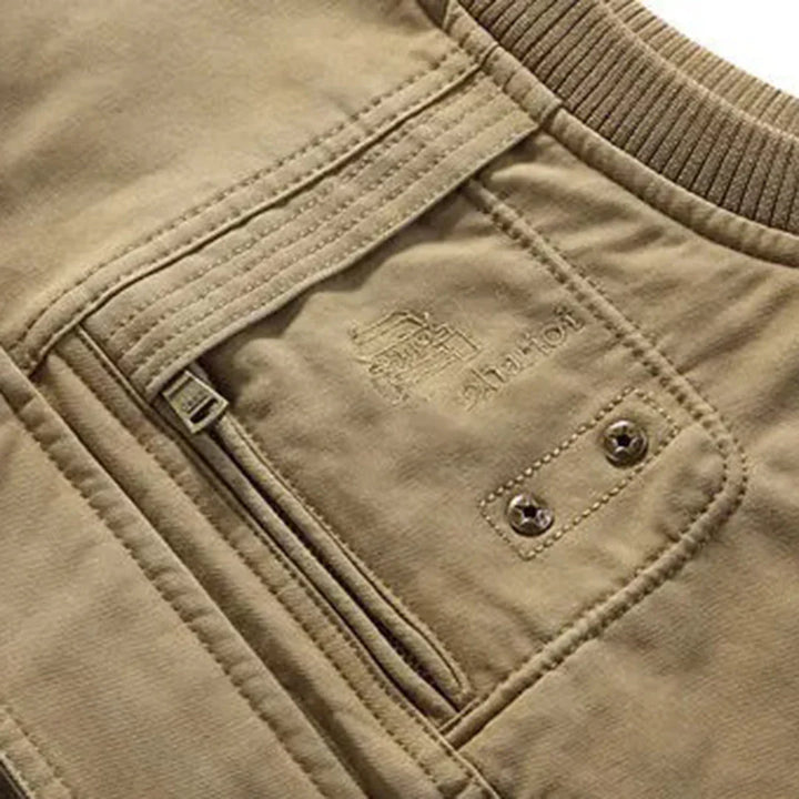 Rugged men's tactical adventure vest with multi-pocket storage for outdoor gear, hiking, and travel. Durable design.