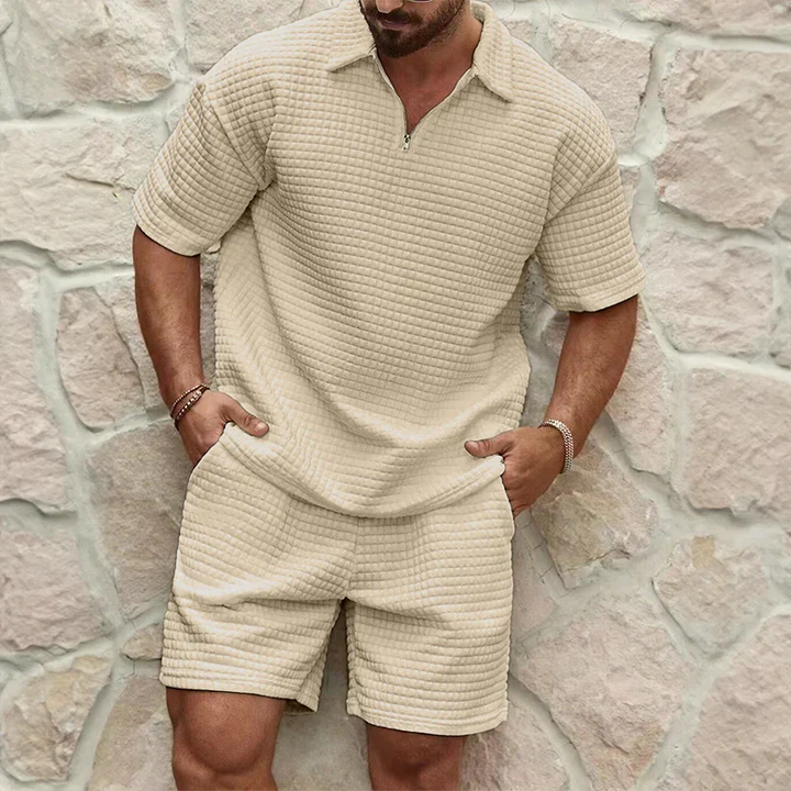 Men's two-piece leisure set in soft poly-cotton, featuring a breathable waffle knit. Ideal casual summer outfit.