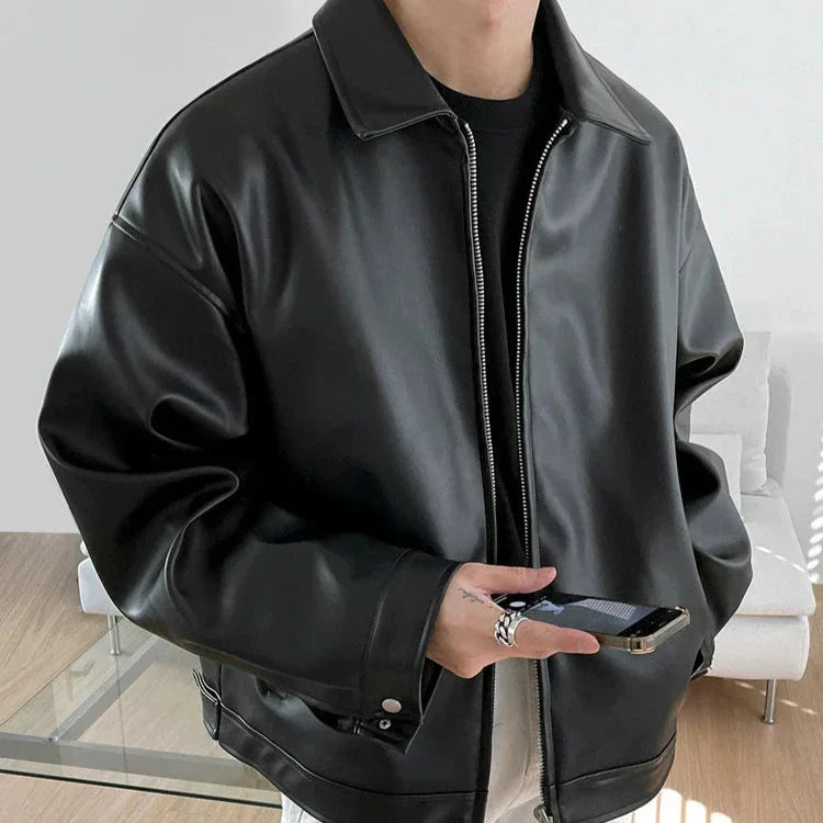 Back view of a men's oversized black faux leather bomber jacket, perfect for winter outerwear