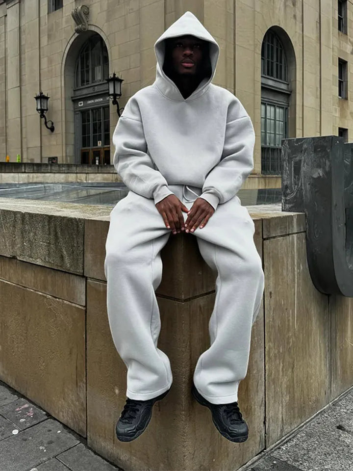 Stylish men's oversized hoodie, part of a relaxed fit tracksuit. Ideal for comfort, casual outfits & men's fashion.
