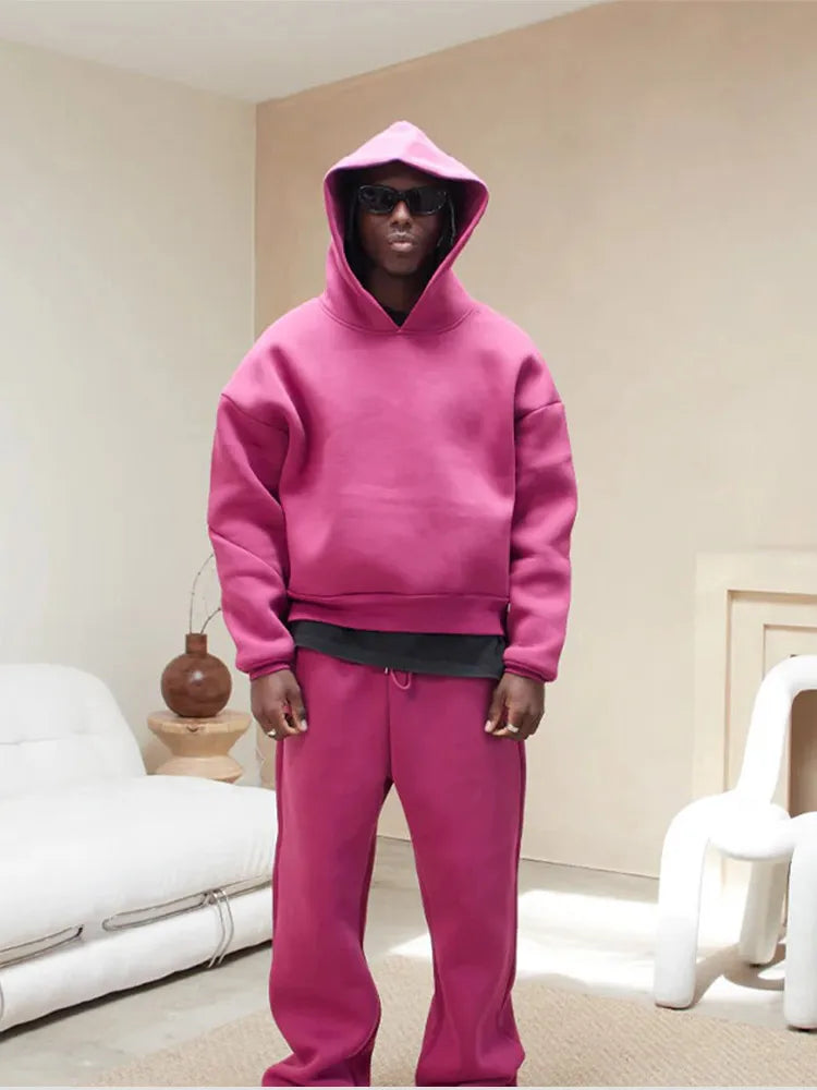 Men's oversized athletic wear tracksuit set, ideal for lounging or active comfort. Includes a hoodie and joggers.