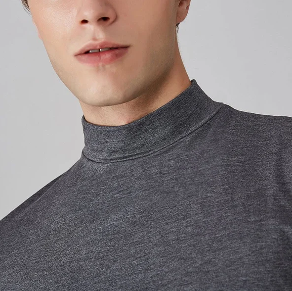 Versatile men's performance turtleneck. Long sleeve athletic top for active lifestyles. Quick-dry & comfortable.