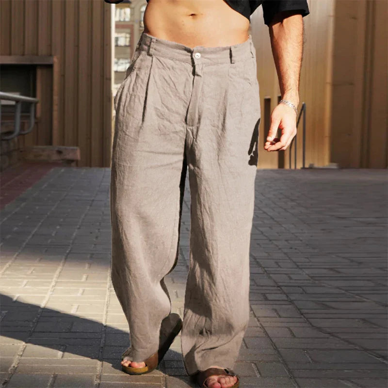 Texture shot of men's comfortable chino pants with stylish pleats and a modern wide leg, great for casual wear.
