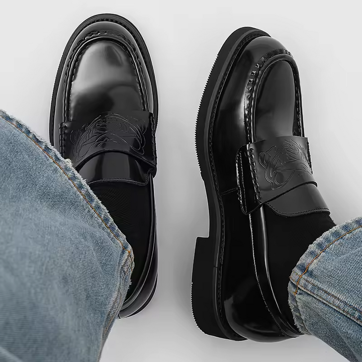 Elegant men's black slip-on loafers, ideal dress shoes for professional settings & smart casual outfits.