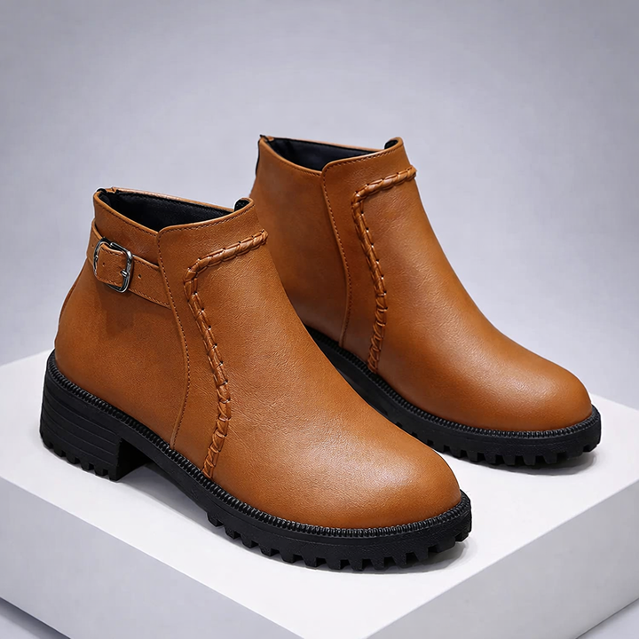 Close-up of men's premium brown leather ankle boots, showcasing texture and quality, orthopedic comfort