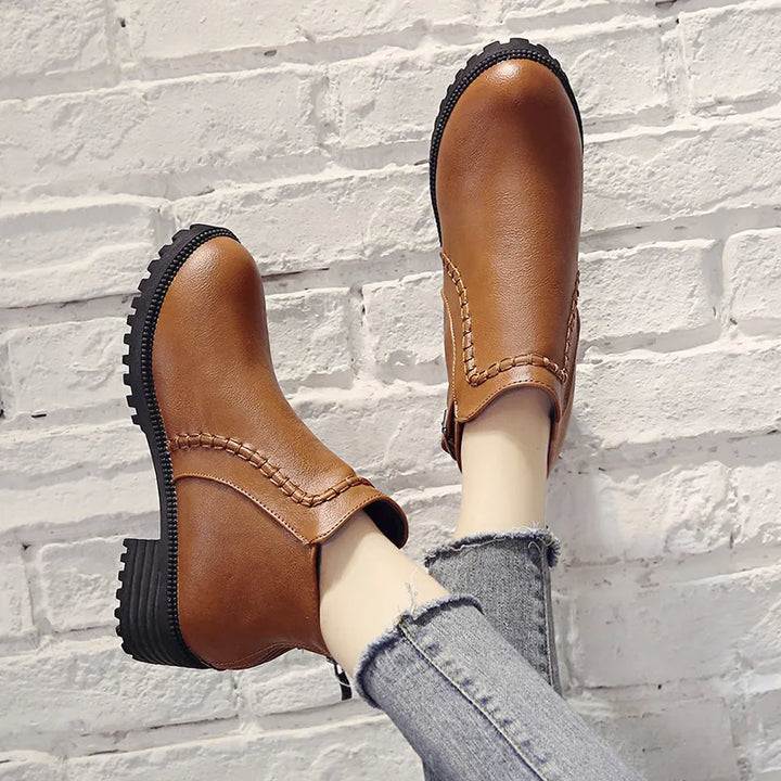 Comfort-focused men's brown leather ankle boots, a durable and casual orthopedic footwear option