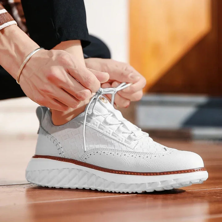 Breathable men's casual sneakers in grey leather, a versatile option for men's fashion.
