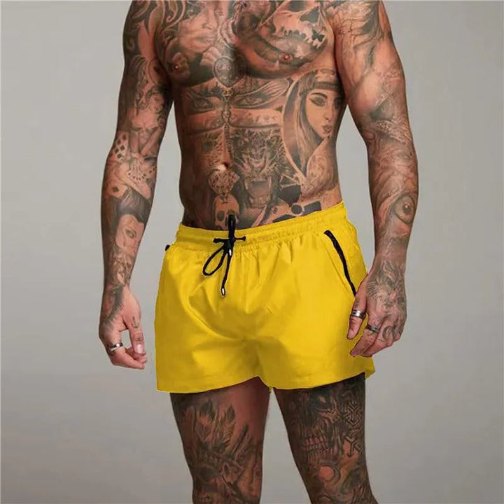 Active men's swim trunks with stretch fabric & drawstring for comfort & performance.