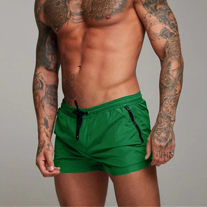 Stylish men's beach shorts, quick-dry & stretch, ideal for vacation or poolside relaxation.