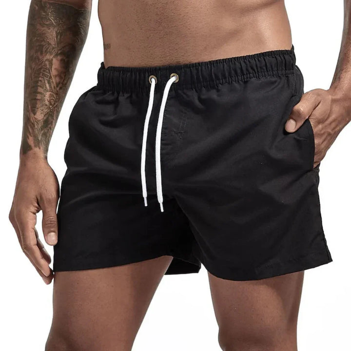 Athletic men's swim shorts with quick-dry tech, great for pool, beach, or summer activities.