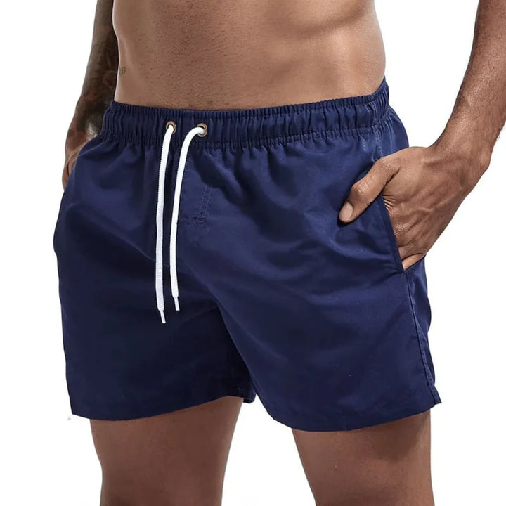 Stylish men's beach shorts, quick-dry design, essential summer fashion for pool & ocean.