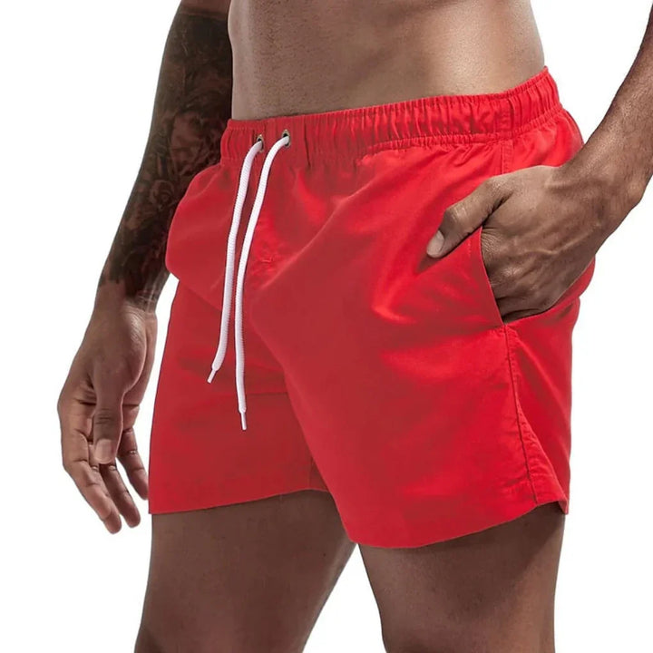 New men's quick-dry swim shorts, breathable & comfortable, perfect for active beach days.