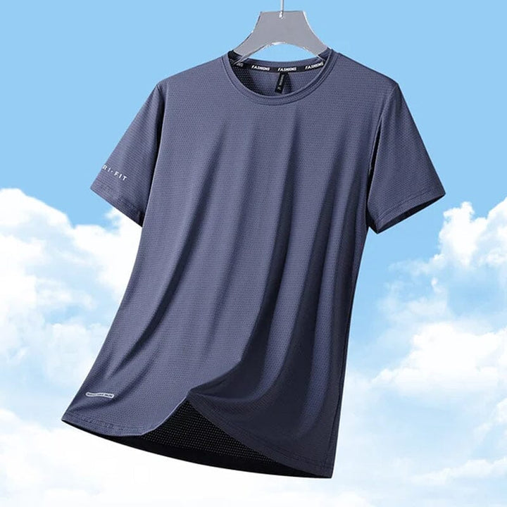 Man casually leaning against a wall, wearing a comfortable quick-dry ice silk t-shirt