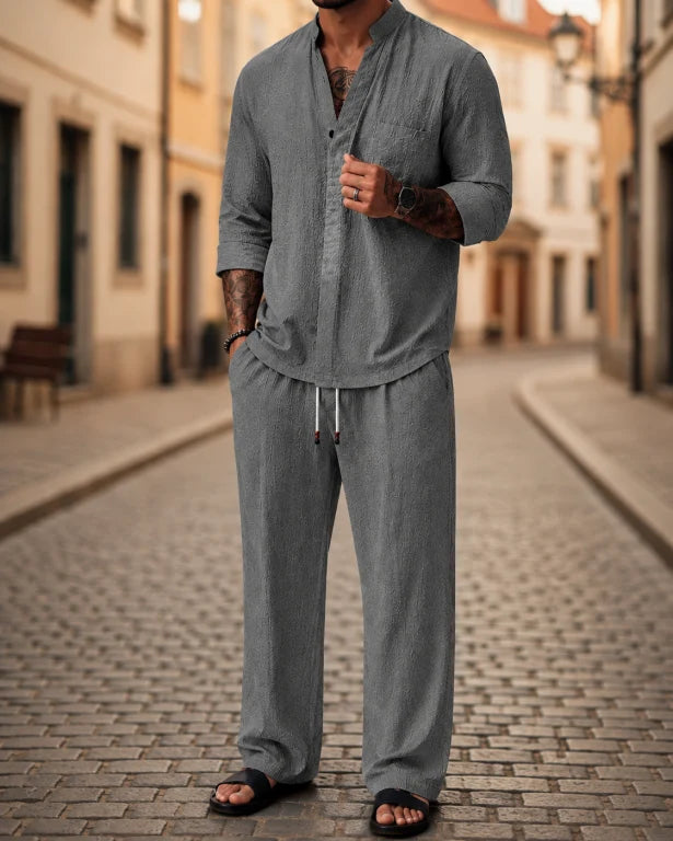 Comfortable men's casual two-piece shirt & pants set. Relaxed fit for summer style, travel, or resort wear.
