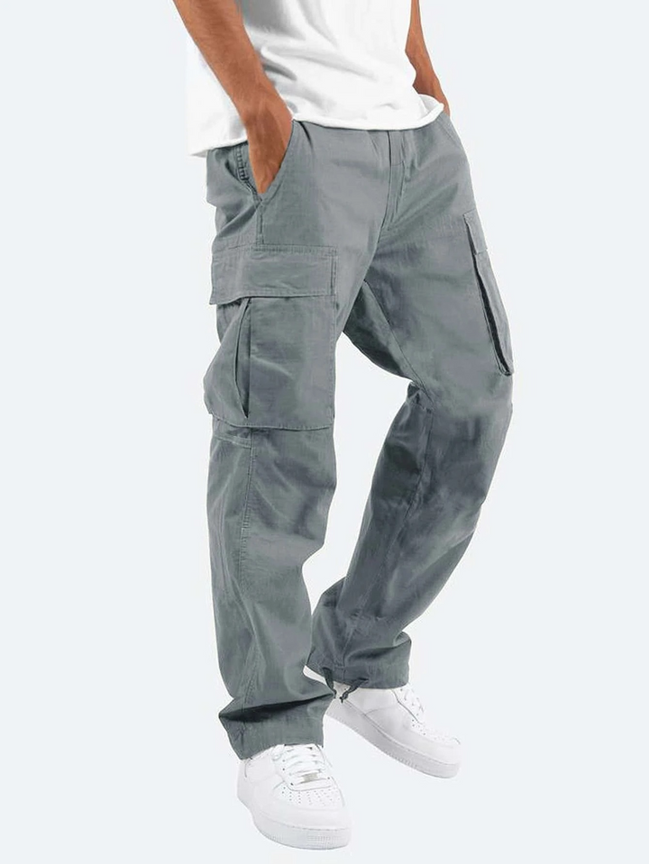 Brown men's cargo pants, relaxed fit. Durable utility trousers with multiple pockets for versatile everyday wear.