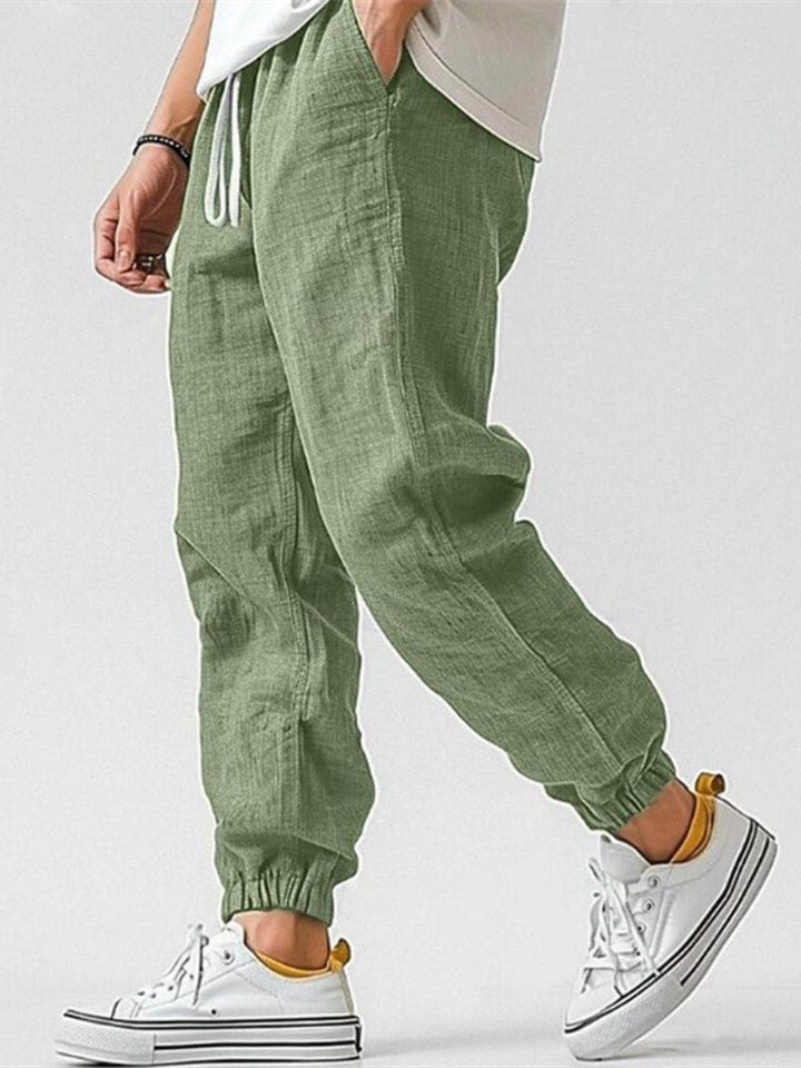 Comfortable men's cuffed joggers, relaxed fit, ideal for summer or active wear.
