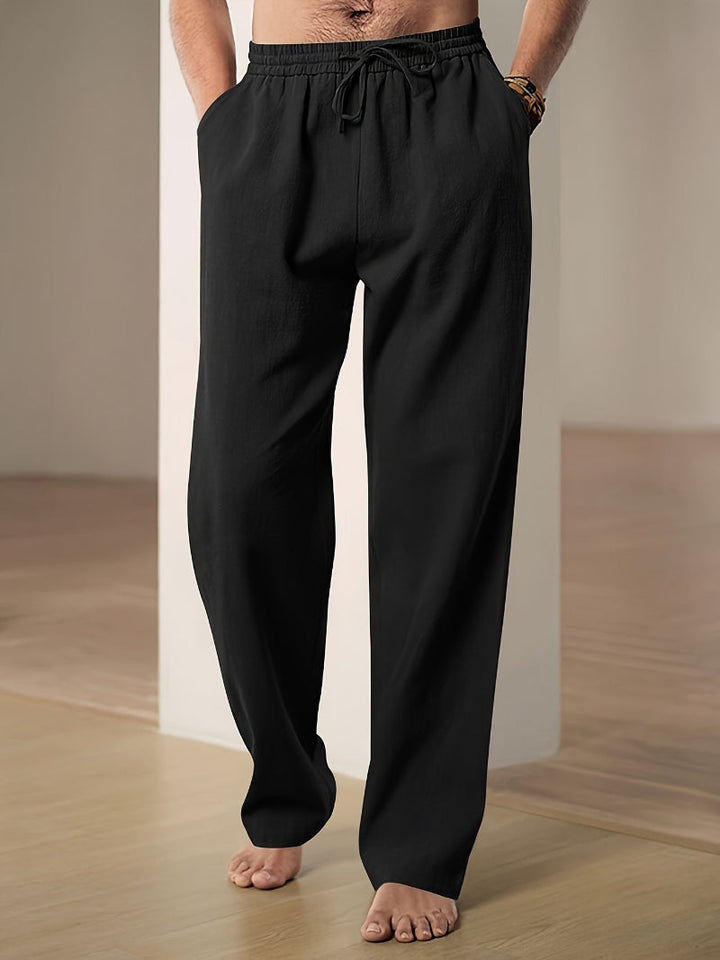 Stylish men's relaxed fit drawstring pants, versatile for smart casual or everyday wear.