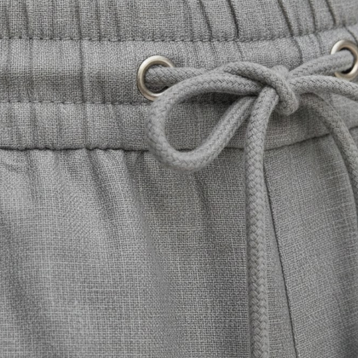 Man wearing comfortable men's relaxed fit drawstring summer shorts, ideal for casual outdoor activities.