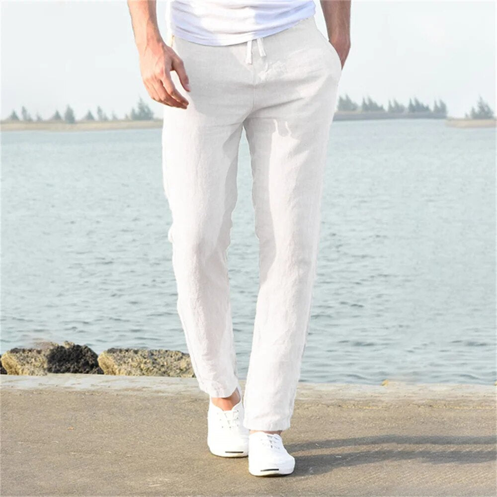 Men's relaxed fit drawstring trousers with practical side pockets, ideal for casual wear.