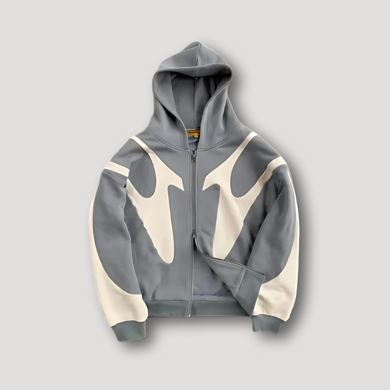Close-up of a men's relaxed fit zip hoodie, showcasing fabric texture and modern design for streetwear.