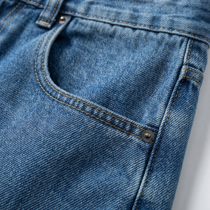 Men's straight leg jeans, relaxed fit blue denim, ideal for casual and versatile men's fashion.