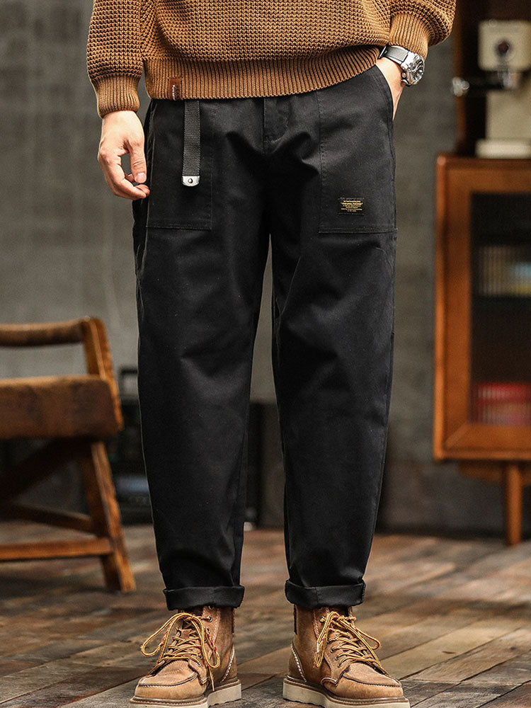 Back view of men's relaxed fit utility pants, highlighting the rear pocket design and comfortable fit.
