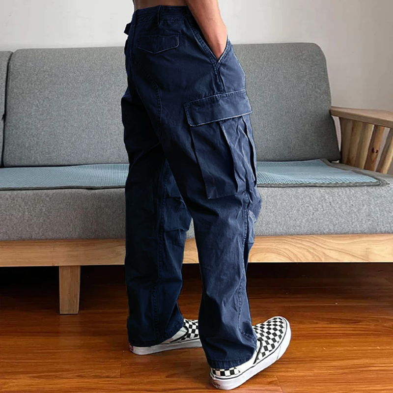 Model in men's relaxed fit washed chino cargo pants, demonstrating comfortable fit for everyday style.