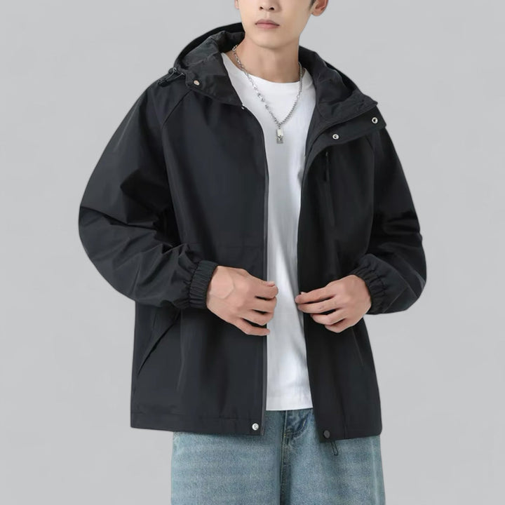 Men's relaxed fit windbreaker jacket for autumn outdoor activities. Lightweight outerwear with weather protection.