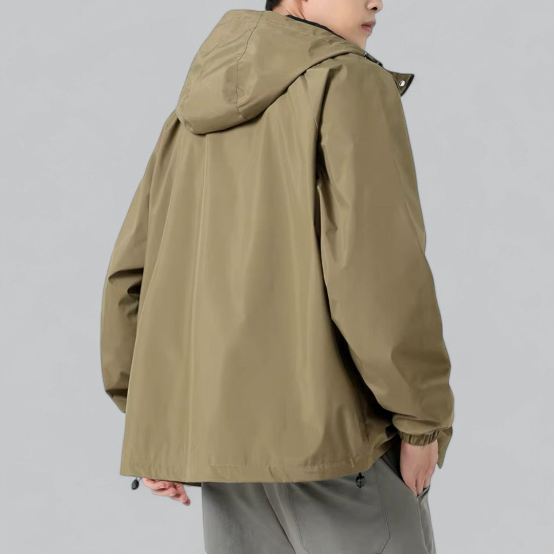 Lightweight men's windbreaker jacket, relaxed fit, providing weather protection for casual outdoor adventures.